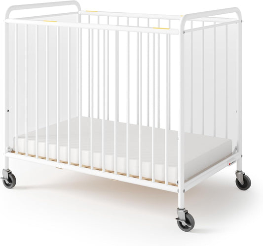 Foundations Chelsea Clearview Metal Compact Daycare Crib, 3" Casters, Compact Mini Size, Easy to Clean Durable Finish, Adjustable to Two Heights Mattress Board (White)