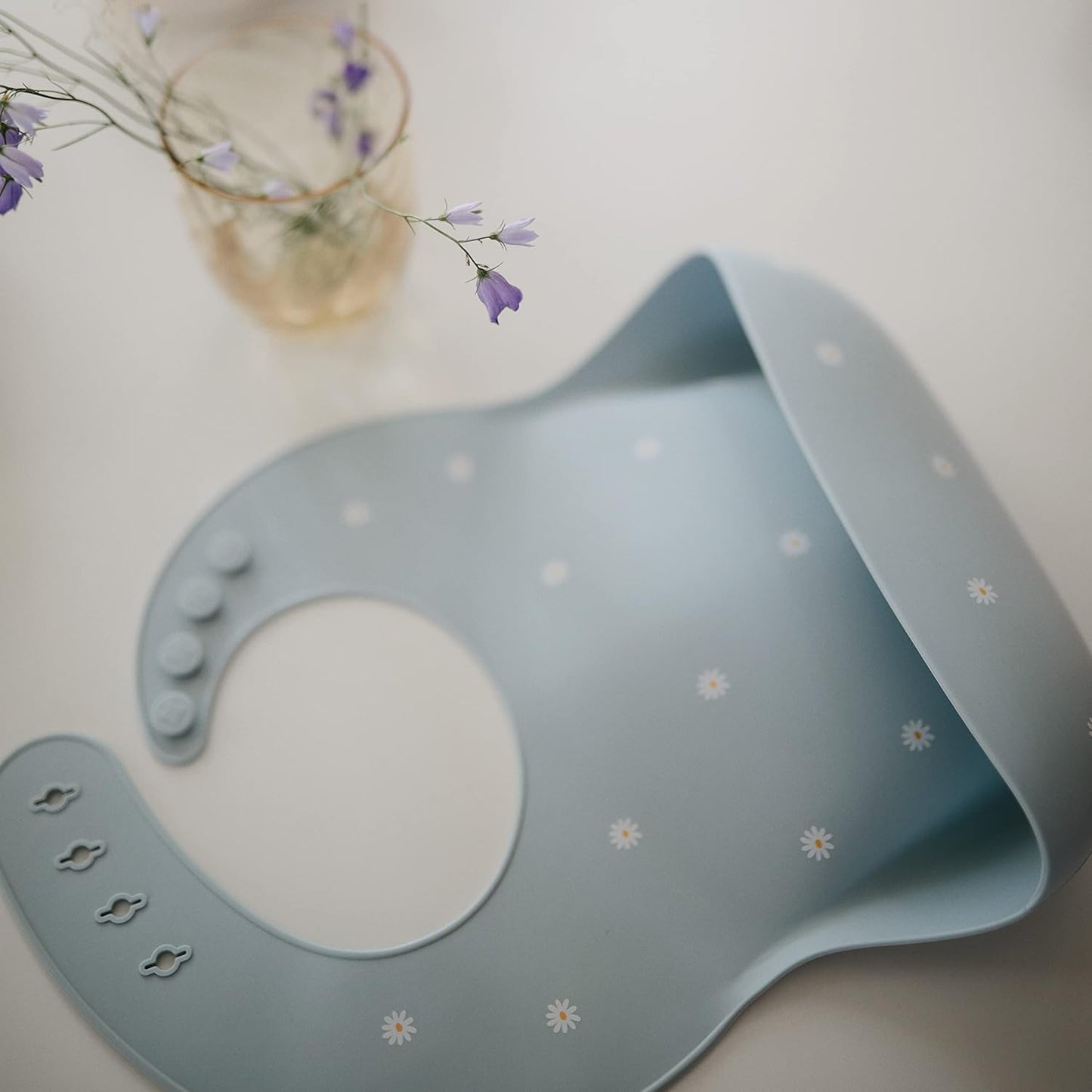 mushie Silicone Baby Bib | Adjustable Fit Waterproof Bibs (White Daisy)